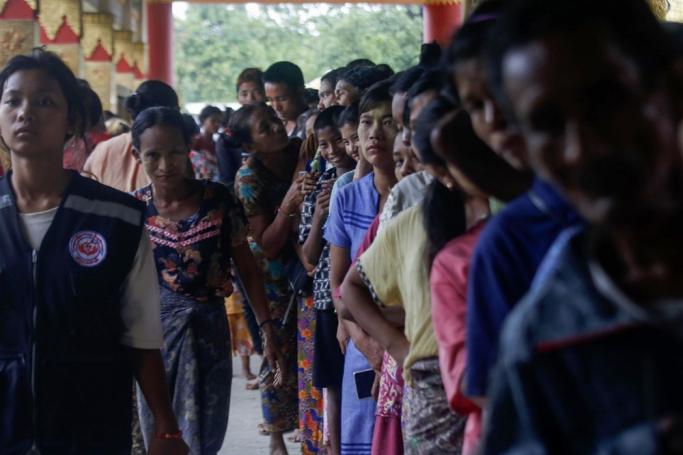 People queue for food at the monastery used as a temporary shelter in Sittwe, Rakhine State, Myanmar, 13 May 2023. Photo: EPA