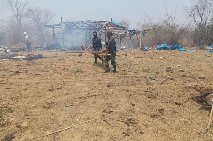 A handout photo made available by Myaelatt Athan local news agency shows members of the People Defense Forces (PDF) carrying the body of a victim after an airstrike by the Myanmar military on Pa Zi Gyi village, Kantbalu township, Sagaing region, Myanmar, 11 April 2023. Photo: EPA