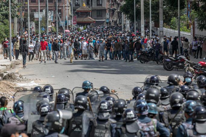 Nepalese devotees and riot police clash ahead of the Rato Machindranath chariot festival procession in Lalitpur, Nepal, 03 September 2020. Photo: EPA