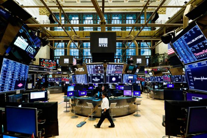 A man sweeps the floor of the New York Stock Exchange after the closing bell in New York, New York, USA, on 20 March 2020. Photo: EPA