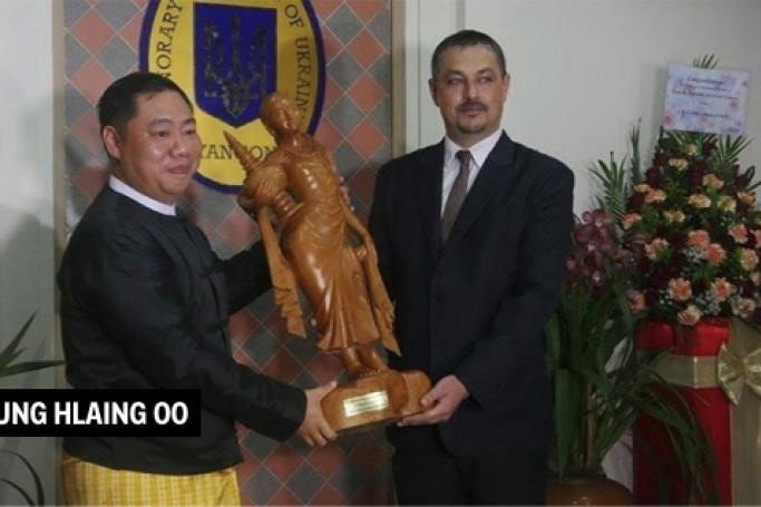 Aung Hlaing Oo (left), who runs MCM, a private arms brokerage firm for the Myanmar military, is seen with the Ukrainian ambassador to Myanmar (right) in 2017.  Photo: Justice For Myanmar