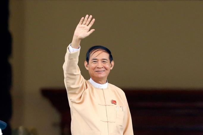 Newly elected president Win Myint and member of the National League for Democracy (NLD) party waves after the voting ceremony at Union parliament session in Naypyitaw, Myanmar, 28 March 208. Photo: Hein Htet/EPA-EFE
