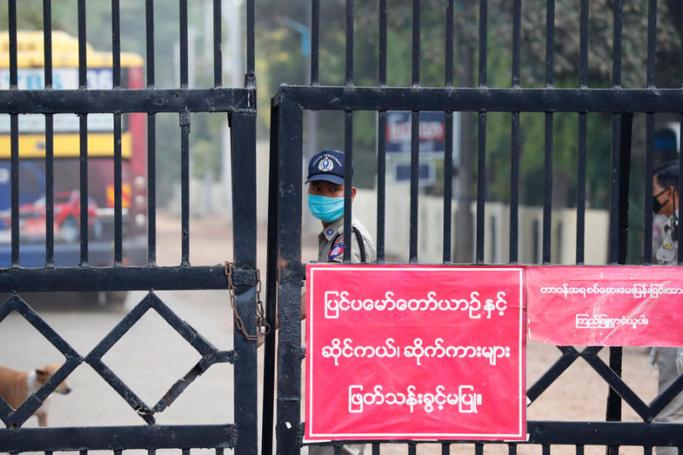 (File) Prison guards stand near the entrance to the Insein Prison in Yangon, Myanmar. Photo: EPA
