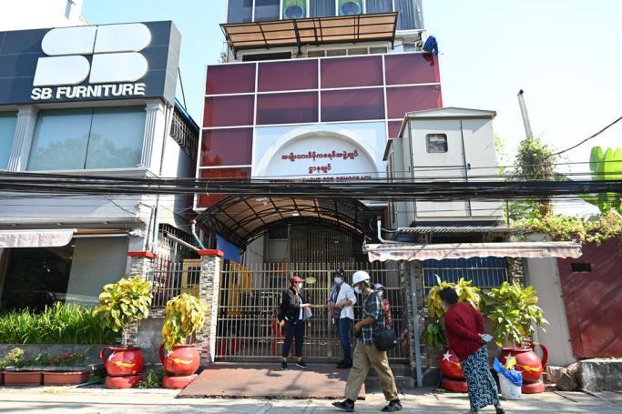 Journalists wait outside the closed National League for Democracy party headquarters in Yangon on February 10, 2021 following an overnight military raid as Myanmar's military tightened their post-coup grip on power. Photo: Ye Aung Thu/AFP