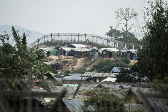 Rohingya refugee shelters are seen in the "no man's land" behind Myanmar's border lined with barb wire fences in Maungdaw district, Rakhine state bounded by Bangladesh on April 25, 2018. Photo: Ye Aung Thu/AFP
