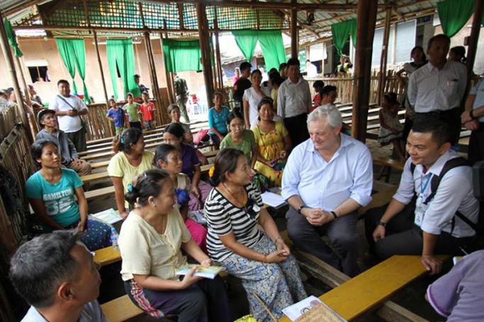 Under-Secretary-General for Humanitarian Affairs, Stephen O’Brien (second right), speaks to people in Kachin state, Myanmar, who are still still displaced after five years of conflict. Photo: OCHA Myanmar
