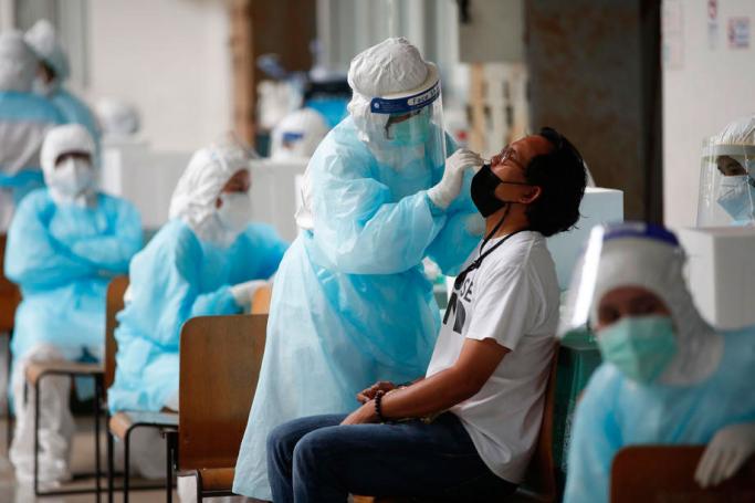 A Thai man undergoes a free COVID-19 nasal swab test for at-risk people in a bid to curb the rapid spreading of the pandemic in Bangkok, Thailand, 17 April 2021. Photo: EPA