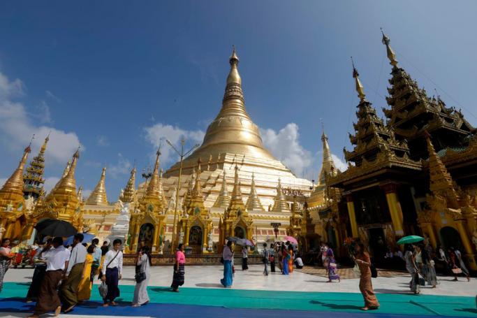 (File) People visit the holy Shwedagon pagoda in Yangon, Myanmar. Photo: EPA