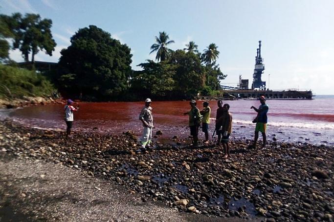 This undated handout picture taken by Nigel Uyam and released by Kessy Sawang of The Basamuk People's Voice on October 24, 2019 shows the coastline and surrounding waters near the Ramu nickel refinery stained an ochre red from toxic slurry at Basamuk Bay, Rai Coast, in Papua New Guinea's Madang province. Photo: AFP