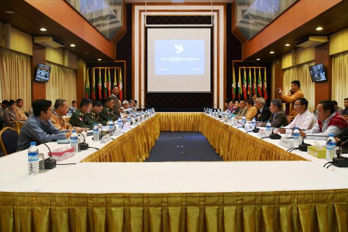 Government delegation and ten Ethnic Armed Organizations hold a preliminary coordination meeting yesterday at the National Reconciliation and Peace Centre in Yangon. Photo: MNA
