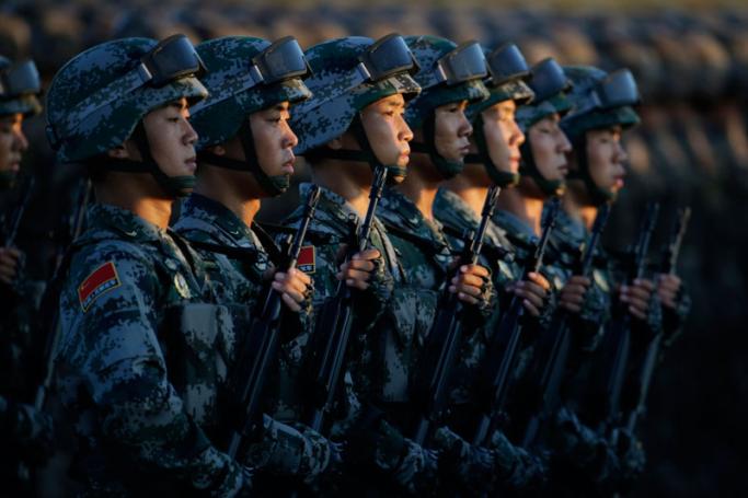 Soldiers of China's People Liberation Army prepare in front of the Tiananmen Gate ahead of the military parade to mark the 70th Anniversary of the end of World War Two, in Beijing. Photo: EPA
