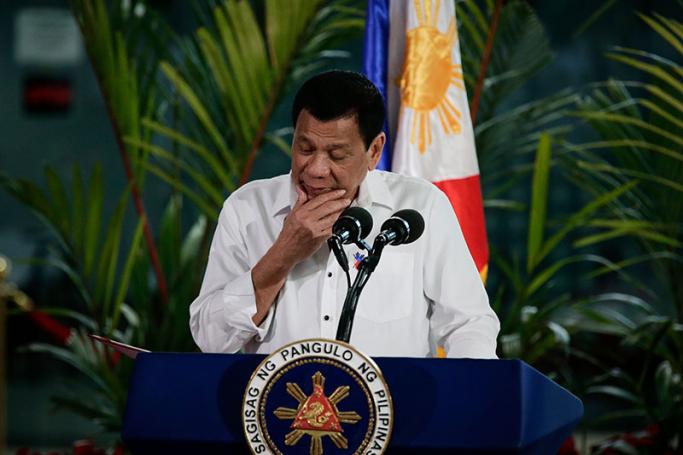 Philippine President Rodrigo Duterte gestures during a press conference prior to his departure for Cambodia at the Manila International Airport in Pasay City, south of Manila, Philippines, 13 December 2016. Photo: Mark R. Cristino/EPA
