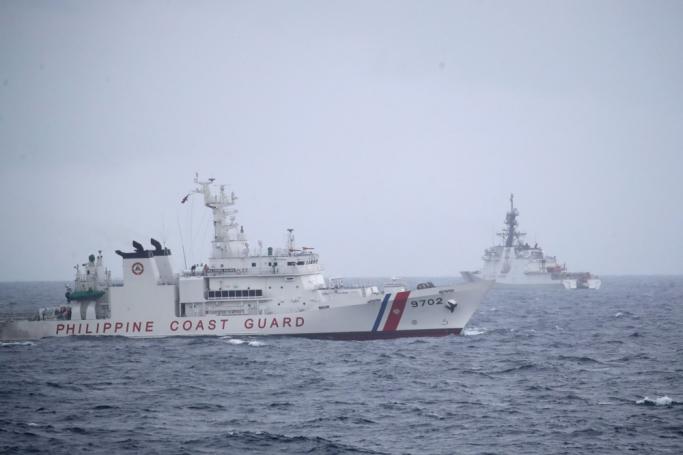 Philippine Coast Guard BRP Melchora Aquino (PCG-BRP 9702) patrol ship (L) and United States Coastguard Cutter (USCGC) Midgett (WMSL-757) (R) maneuver during a maritime drill in the disputed South China Sea, Philippines. Photo: EPA