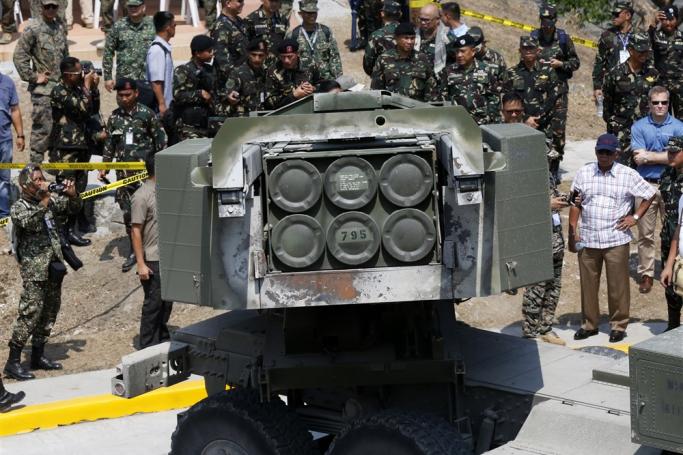 (File) US Marines and Filipino soldiers stand next to a High Mobility Artillery Rocket System (HIMARs) during joint military exercises at Crow Valley in the town of Capas, Tarlac province, Philippines, 14 April 2016. Photo: EPA