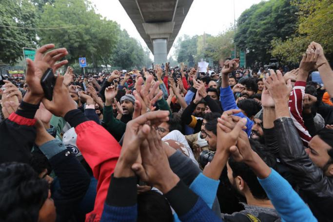 Indian protesters shout slogans outside the Jamia Millia Islamia University during a protest against the Citizenship (Amendment) Bill 2019 (CAB) in New Delhi, India, 16 December 2019. Photo: EPA