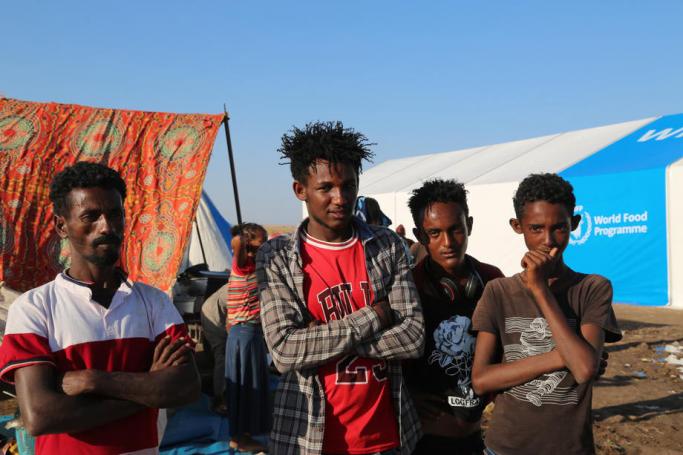 A handout photo made available by the UN World Food Programme (WFP) shows Ethiopian refugees who fled the conflict in Ethiopia's Tigray region posing for a photograph in Hamdayet Reception Center, in the border town of Hamdayet, Sudan, 17 November 2020. Photo: EPA