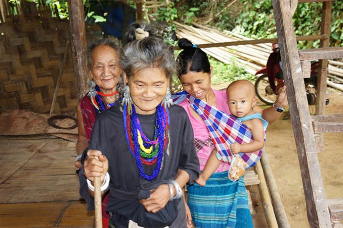 Elderly women and a mother and her child leaving a session on family focus groups at a refugee camps in Mae Hong Son province of Thailand. Photo: Nick Jones/Jesuit Refugee Service
