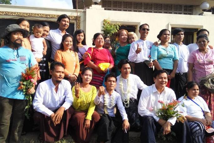 Family members and friends of political activists and released political prisoners of Nay Myo Zin, Htin Kyaw and Tin Htut Paing pose for group photo after their release from the Insein prison in Yangon, Myanmar, 17 April 2016. Photo: Ye Mon/Mizzima

