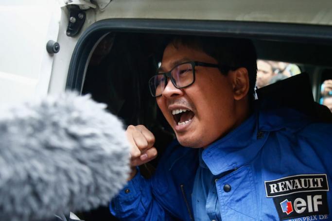 Reuters' journalist Wa Lone shouts as he leaves after his trial at Mingaladon township court in Yangon, Myanmar, 27 December 2017. Photo: Lynn Bo Bo/EPA-EFE
