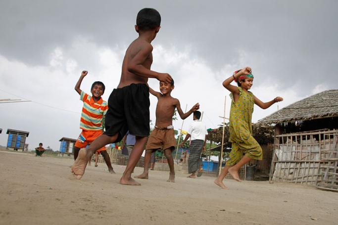 Rohingya children play at an Internally Displaced Persons (IDPs) camp near Sittwe of Rakhine State, western Myanmar. Photo: Nyunt Win/EPA
