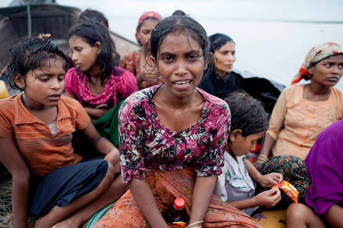(File) A Rohingya Muslim girl cries as she sits in a boat after they were intercepted by the Bangladesh Border Guard (BGB) members in Teknaf, Bangladesh, 13 June 2012. Photo: EPA
