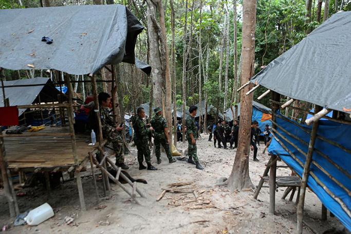 (File) Thai soldiers secure the area next to shelters after discovering another abandoned jungle camp believed used by the human traffickers to detain Rohingya migrants at a mountain in Sadao, Thai-Malaysian border district, Songkhla province, southern Thailand, 12 May 2015. Photo: EPA
