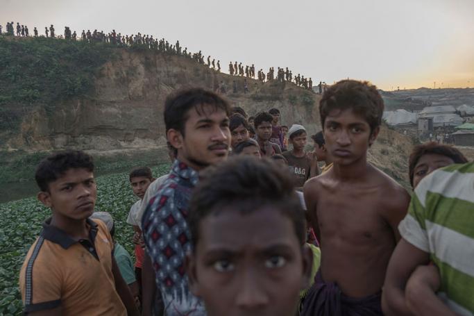 This file photo taken on November 27, 2017 shows Rohingya Muslim refugees looking on near Kutupalong refugee camp in Cox's Bazar. Photo: Ed Jones/AFP
