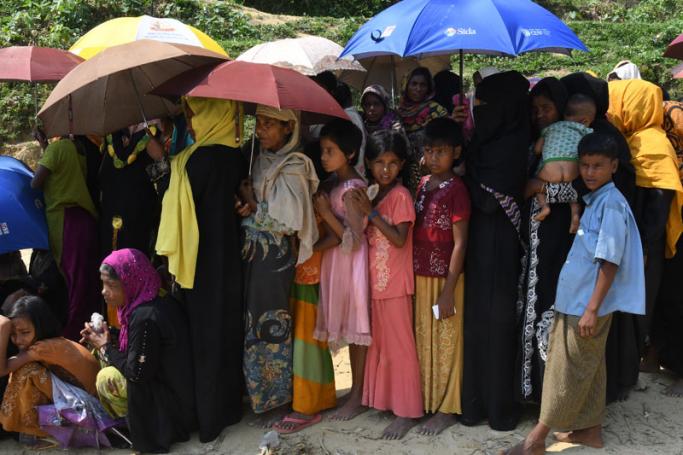 Rohingya Muslim refugees wait for relief aid at Balukhali refugee camp in the Bangladeshi district of Ukhia on October 25, 2017. Photo: Tauseef Mustafa/AFP
