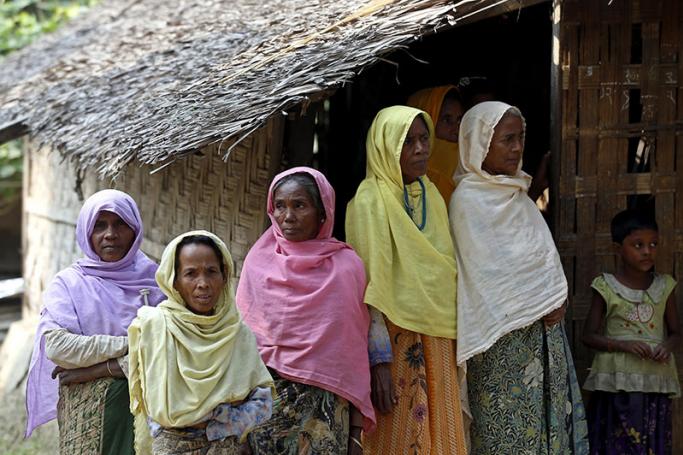 Muslim women stand at the Pyaung Bate village near  Maungdaw town, Rakhine State, western Myanmar, 21 December 2016. Photo: Nyein Chan Naing/EPA
