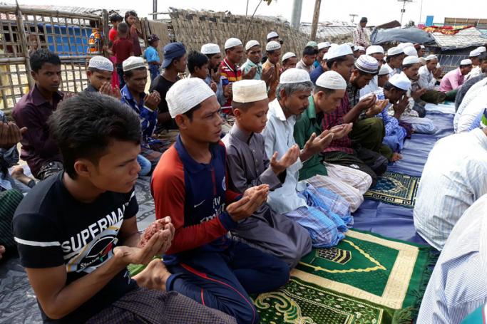 Rohingya Muslims offer Eid al-Fitr prayers at a camp mosque in Kutupalong refugee camp in Cox's Bazar, Bangladesh on June 16, 2018. Photo: AFP
