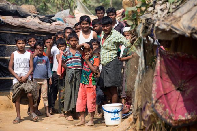 Rohingya refugees gather during a visit of Swiss Federal President Alain Berset (Not Pictured) in the Kutupalong Rohingya refugee camp, in Cox's Bazar, Bangladesh, 06 February 2018. Photo: Peter Klaunzer/EPA-EFE
