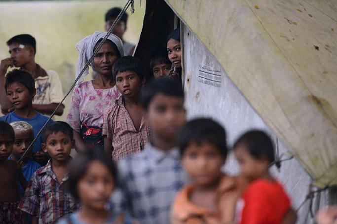 This picture taken on October 10, 2012 shows Muslim Rohingyas pictured outside their tents at the Dabang Internally Displaced Persons (IDP) camp, located on the outskirts of Sittwe, capital of Myanmar's western Rakhine state. Photo: AFP