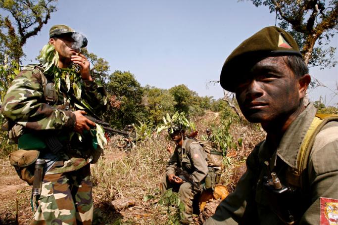 Camouflaged Shan State Army's guerrillas on patrol near their stronghold of Doi Tailang, Shan state, Myanmar, Wednesday 07 February 2007. Photo: Rungroj Yongrit/EPA

