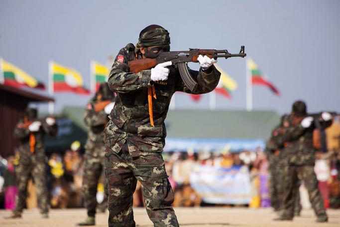 This picture taken on February 7, 2015 shows Shan State Army - South (SSA-S) commandos demonstrating their combat skills during a military parade marking the Shan National Day at their headquarters in Loi Tai Leng, in Myanmar's northeastern Shan State. Photo: KC Ortiz/AFP
