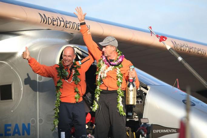 After covering some 8,200 kilometres over the course of 120 hours, pilot co-founder Andre Borschberg (R) and his colleague Bertrand Piccard (L) celebrate the landing of the Solar Impulse 2 in Honolulu, Hawaii, USA, 3 July 2015. Photo: Bruce Omori/EPA
