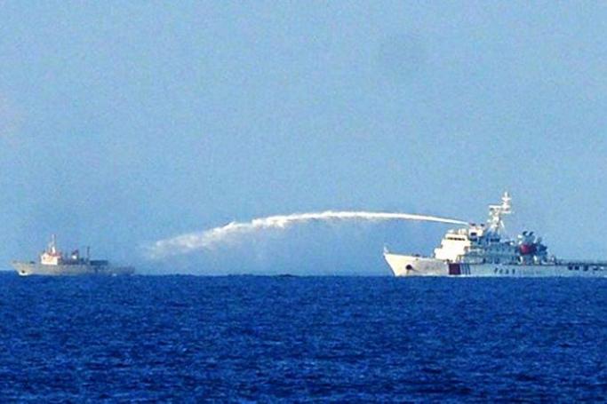 A Chinese Coast Guard vessel (right) using water cannon against a Vietnamese fisheries surveillance ship in disputed waters of the South China Sea off Vietnam’s central coast, in a file photo taken on June 2, 2014. Reports of an encounter between the two countries in the South China Sea in June 2011 were censored by the Myanmar authorities in China’s favour. Photo: AFP/Vietnam News Agency
