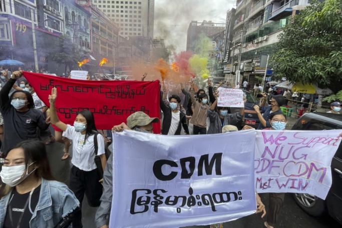 (File) Demonstrators holding posters and banners march during an anti-military coup protest at downtown area in Yangon, Myanmar, 26 June 2021. Photo: EPA