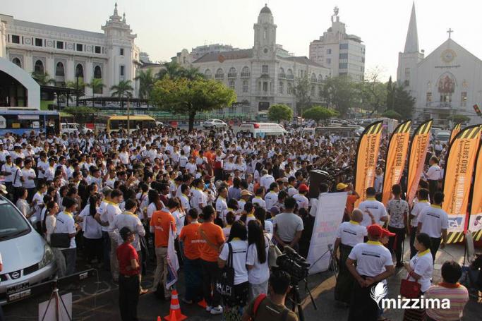 A crowd gathers at Maha Bandoola Park in central Yangon on 4 April 2017 to hear about the new "Start With Me" Road safety campaign.

