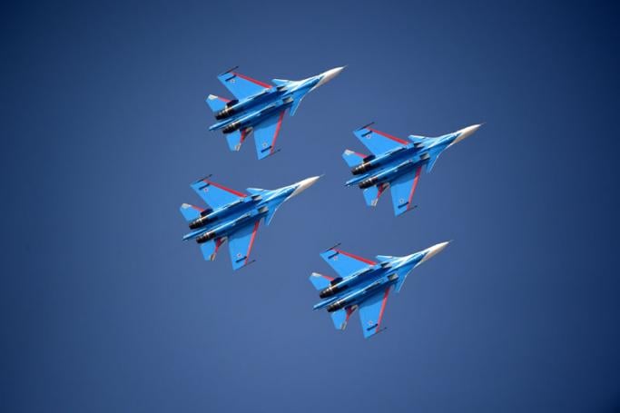 The Russian Knights aerobatic team performs with Sukhoi Su-30 fighters during the opening day of Dubai Airshow, UAE, 12 November 2017. Photo: Martin Dokoupil/EPA-EFE
