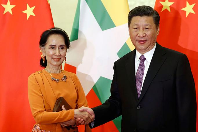 Myanmar State Counsellor Aung San Suu Kyi (L) shakes hands with Chinese President Xi Jinping (R) as they meet at the Great Hall of the People in Beijing, China, 16 May 2017. Photo: EPA
