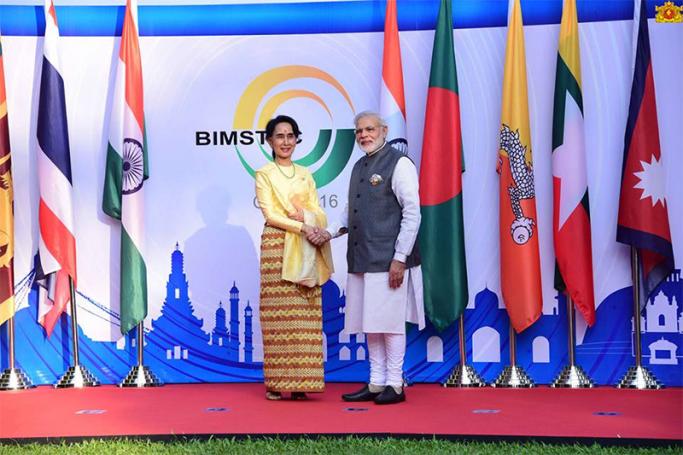 Indian Prime Minister Narendra Modi shakes hands with Myanmar Foreign Minister and State Counselor Aung San Suu Kyi at BRICS-BIMSTEC summit 2016 on the sidelines of the 8th BRICS summit in Goa, India, 16 October 2016. Photo: Myanmar State Counsellor Office
