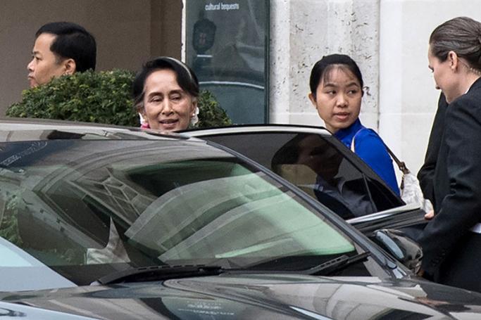 Myanmar's de facto leader Aung San Suu Kyi (2L) leaves the Guildhall, in the City of London on May 8, 2017, after attending an event. Photo: Chris J Ratcliffe/AFP
