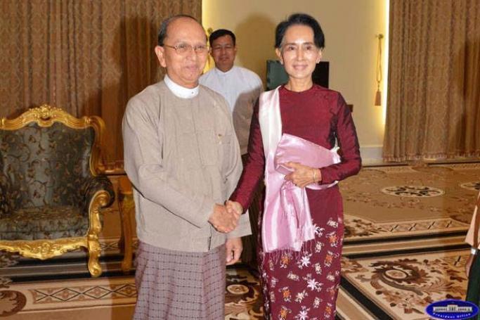 Aung San Suu Kyi, the chairperson of the National League for Democracy, shanks hands with President Thein Sein at the President's house in Nay Pyi Taw on 2 December 2015. Photo: Myanmar President Office
