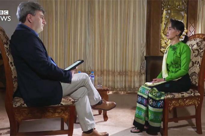 Myanmar State Counsellor Aung San Suu Kyi (right) speaks to BBC's Fergal Keane.
