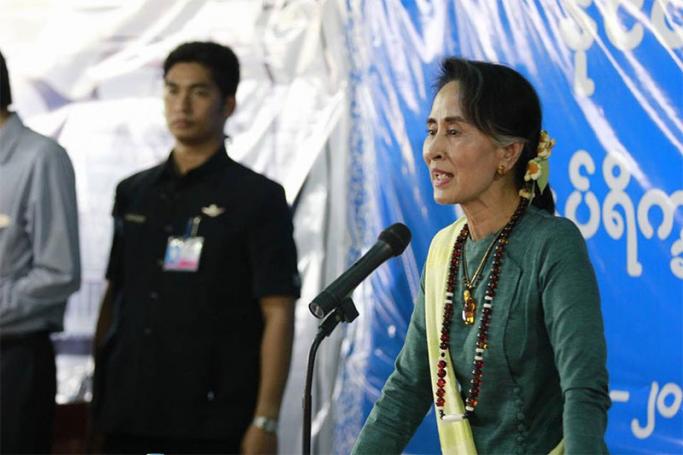 Myanmar State Counselor Aung San Suu Kyi talks to people at Mai Na internally displaced persons (IDPs) camp near Myitkyina, the capital of Kachin State on 28 March 2017. Photo: Min Min/Mizzima
