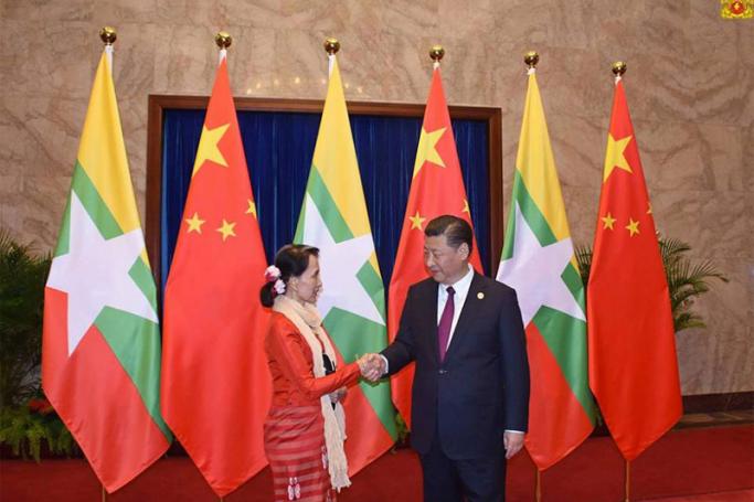 Myanmar State Counsellor Aung San Suu Kyi, left, with Chinese leader Xi Jinping, right. Photo: State Counsellor Office
