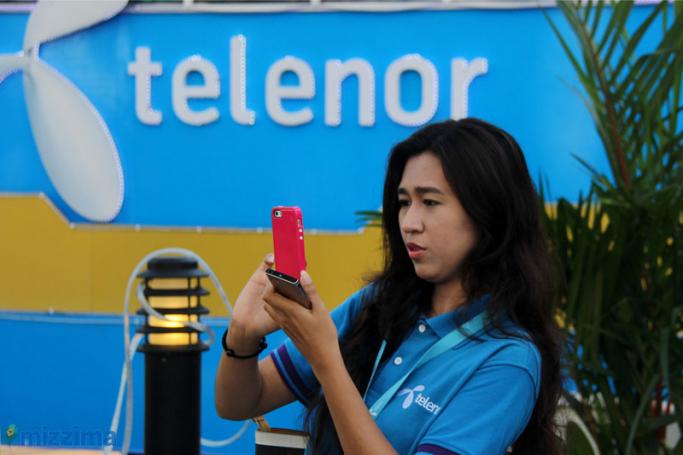 A Telenor staff at a show room in Yangon. Photo: Mizzima
