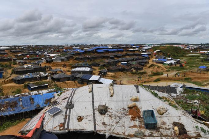 This photo taken on October 7, 2017 shows a solar panel on the roof of temporary homes of Rohingya refugees at the Kutupalong refugee camp in Cox's Bazar. Photo: Indranil Mukherjee/AFP
