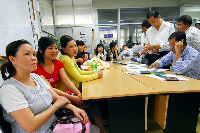 Thai police officers investigating rescued Vietnamese women after raiding a surrogacy clinic in Bangkok, Thailand, on February 23, 2011. Thai police arrested a group of Taiwan nationals for running the Baby 101 Company with hiring illegal immigrants and human trafficking, offering surrogacy birth services in Bangkok using Vietnamese women. Photo: EPA
