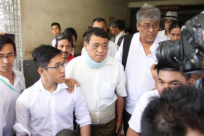 Than Htut Aung (C), CEO of the Eleven Media Group, leaves from the court house in Yangon on January 6, 2017. Photo: Thura/Mizzima

